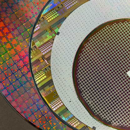 Framed silicon wafer evolution 100-200mm in room display Silicon Masters