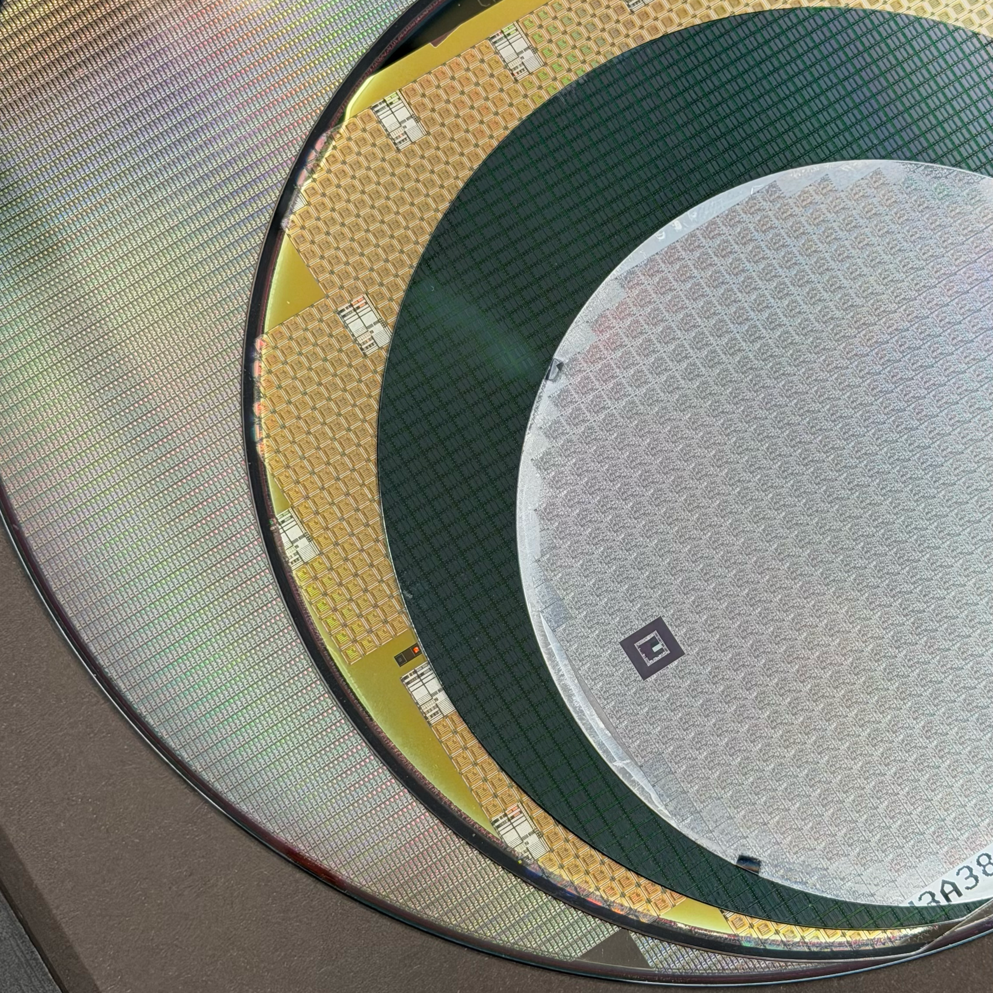 Framed silicon wafer evolution 100-200mm in room display Silicon Masters