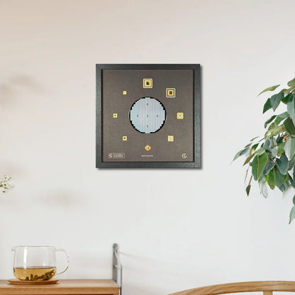 Framed artwork on a wall above a wooden cabinet with a plant and glass in the foreground.
