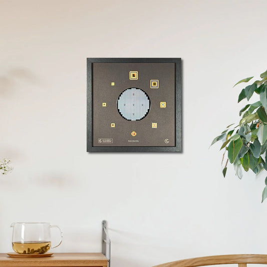 Framed artwork on a wall above a wooden cabinet with a plant and glass in the foreground.