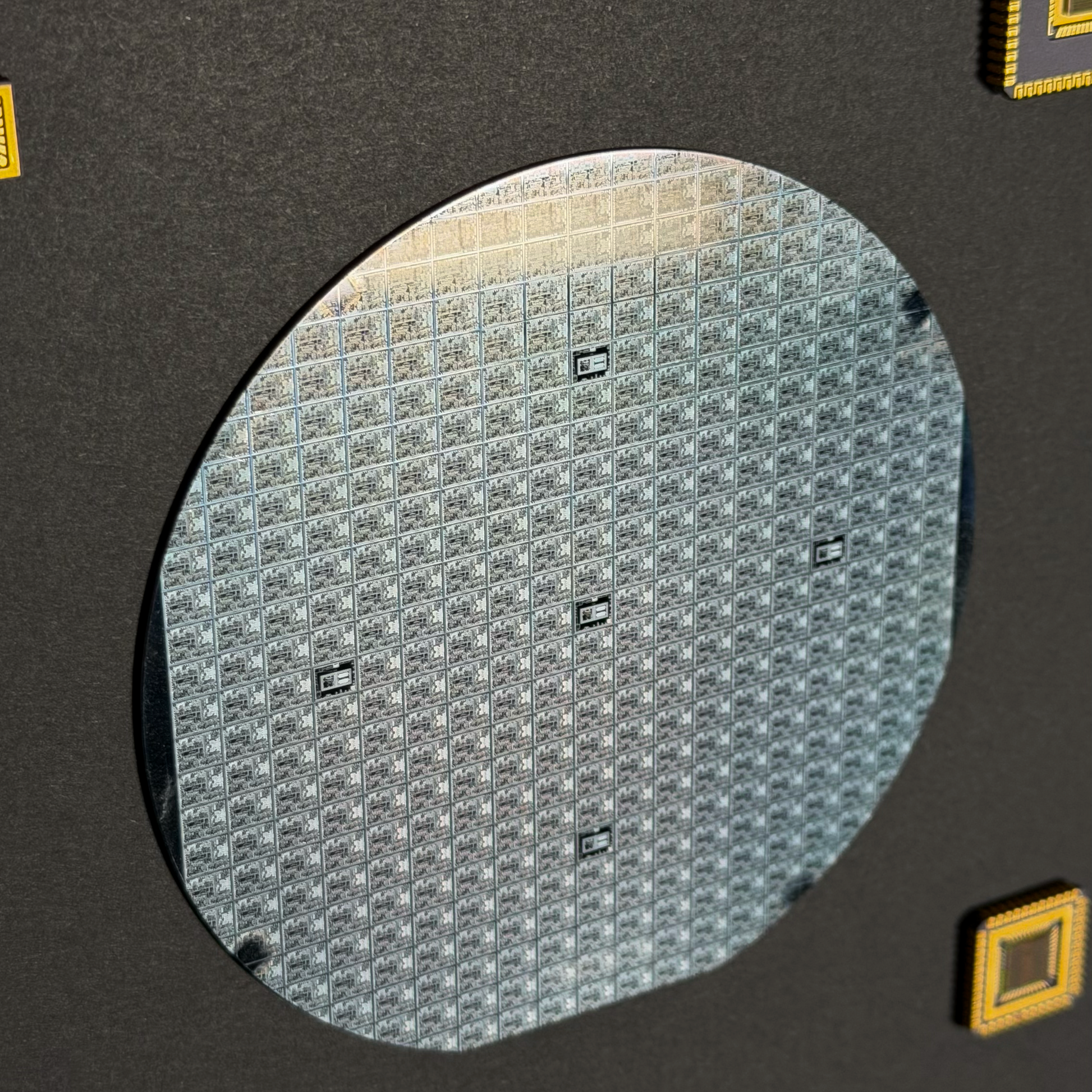 Framed 100mm silicon wafer master collection in room display Silicon Masters