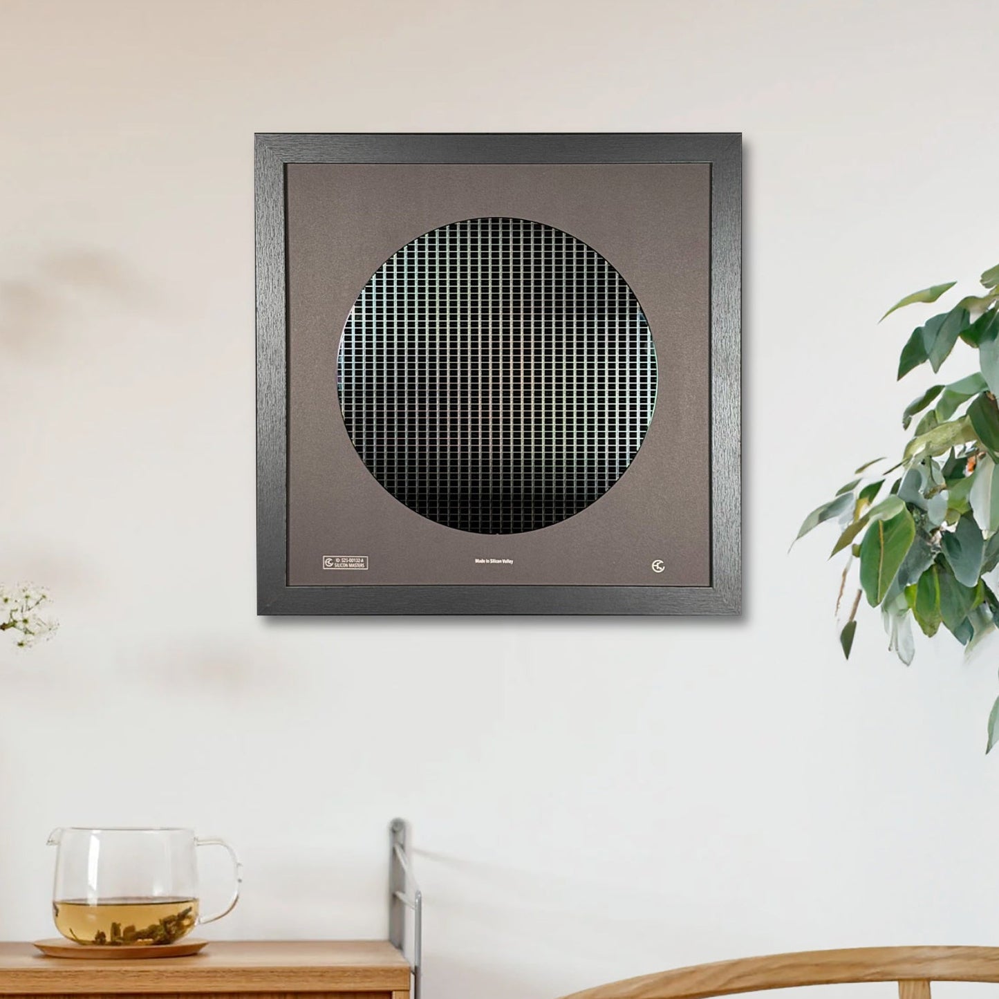Modern wall-mounted air purifier in a room with a wooden cabinet and plant.