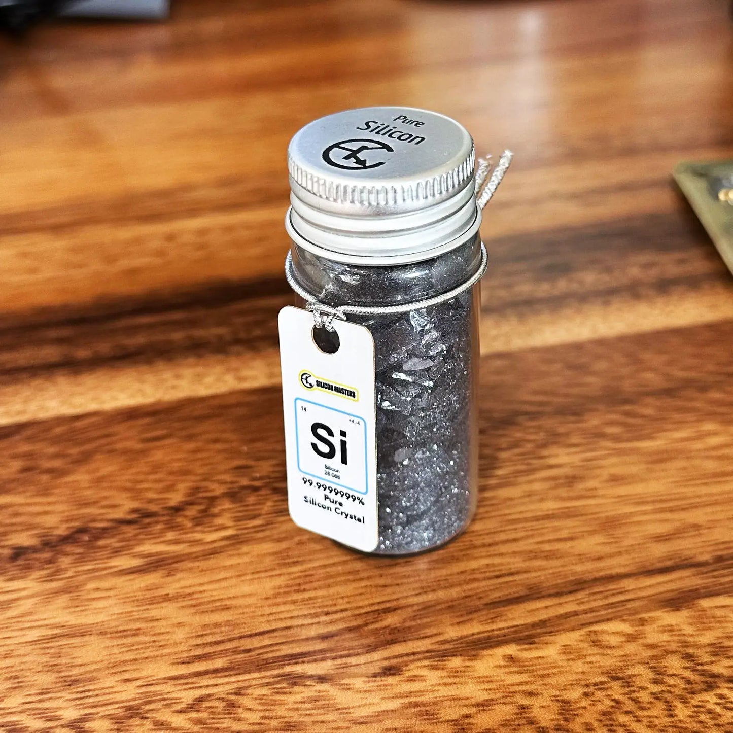 Vial of silicon crystal 99.9999999 percent pure from silicon ingot Silicon Masters desk art