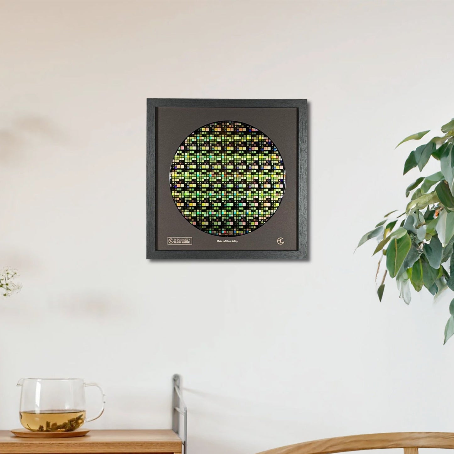 Decorative wall art piece with a circular design on a white wall, next to a wooden cabinet and a plant.