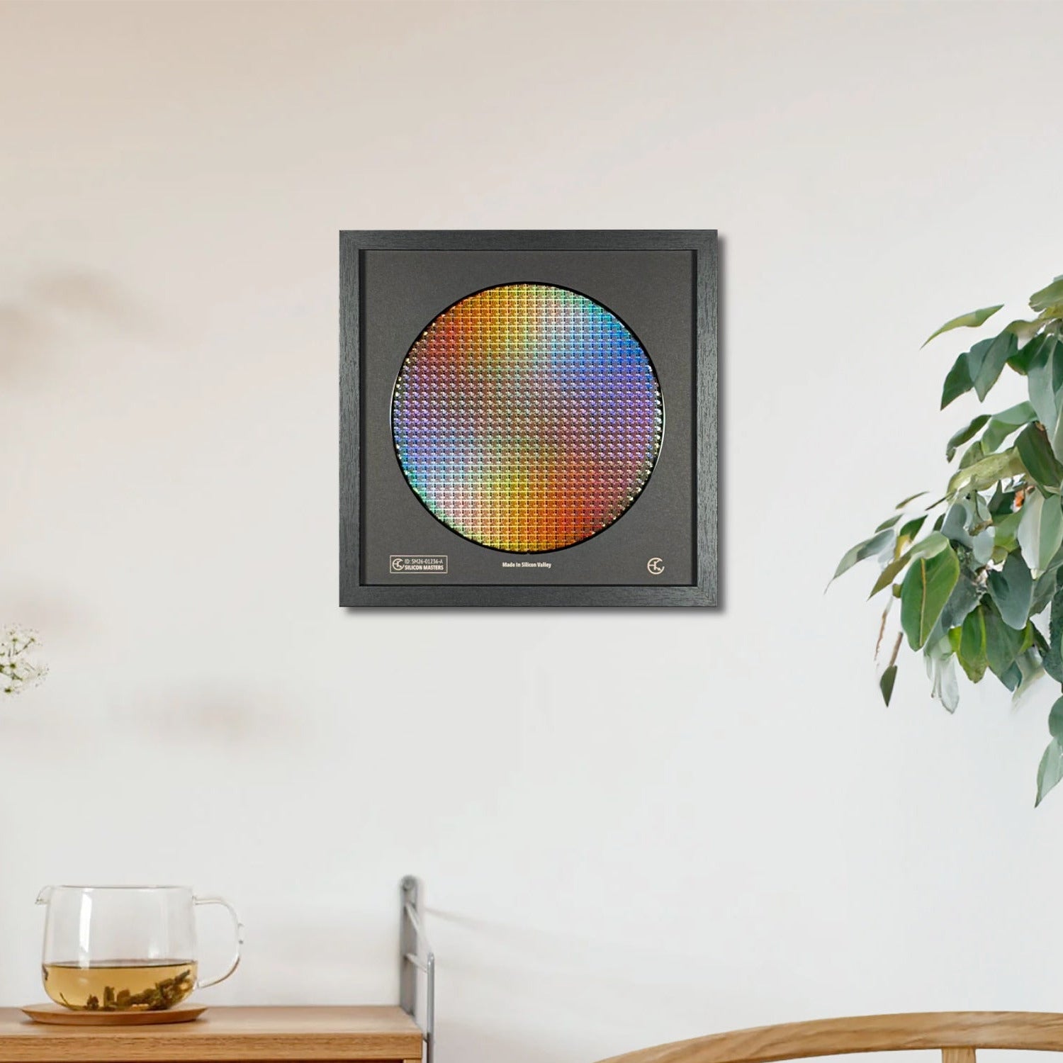 Colorful circular object on a wall in a room with a wooden cabinet and plant.